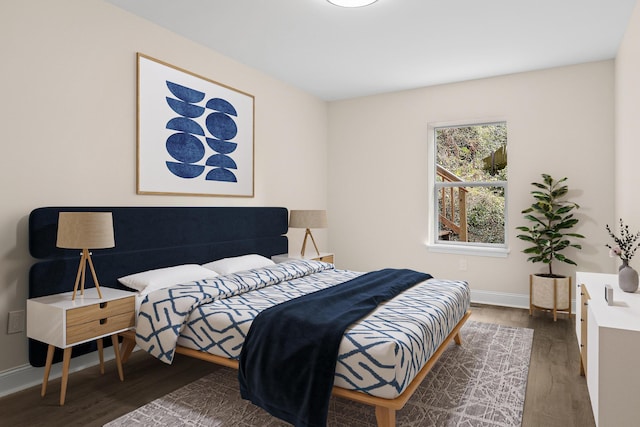 bedroom with dark hardwood / wood-style floors