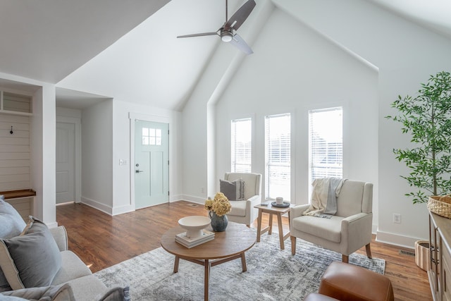 living room with wood-type flooring, high vaulted ceiling, and ceiling fan