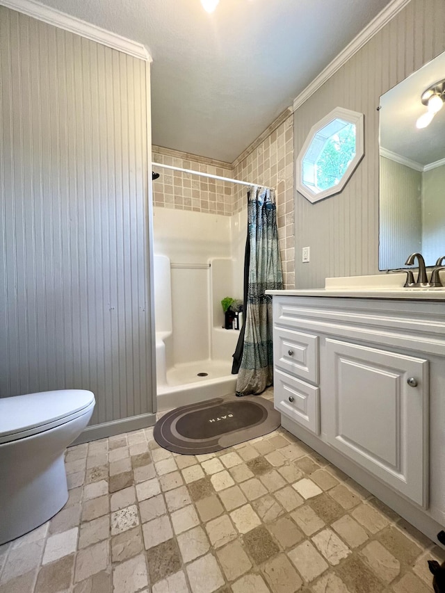 bathroom featuring vanity, crown molding, toilet, and a shower with shower curtain