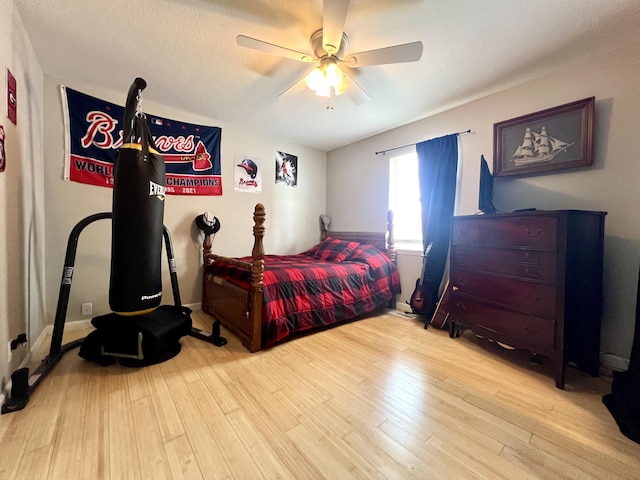 bedroom with ceiling fan and light wood-type flooring