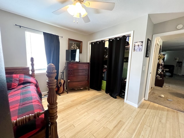 bedroom with ceiling fan and light wood-type flooring