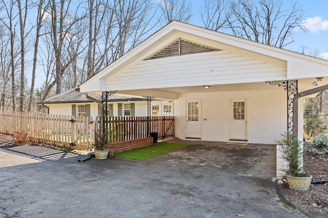 view of front of property featuring a carport