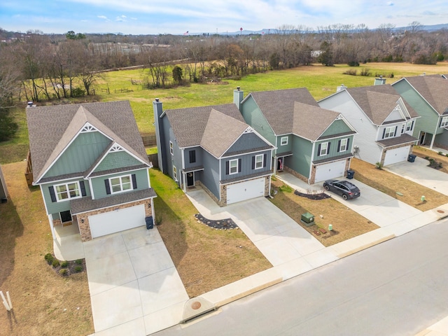 birds eye view of property with a residential view