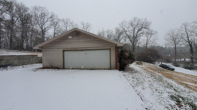 view of snow covered garage