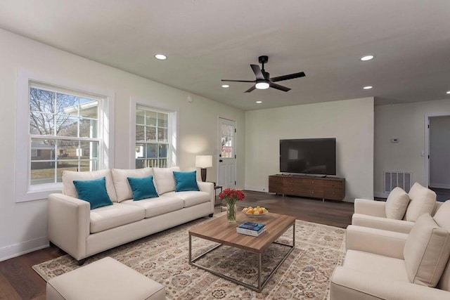 living room with hardwood / wood-style flooring and ceiling fan