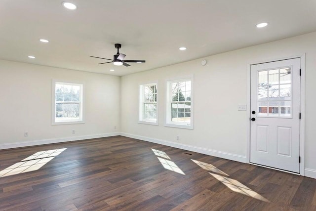 foyer with dark wood-type flooring, ceiling fan, and a healthy amount of sunlight