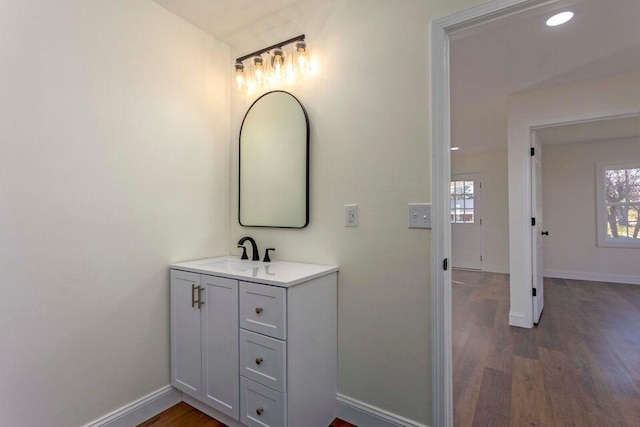 bathroom with vanity and hardwood / wood-style floors