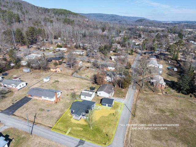 drone / aerial view featuring a mountain view