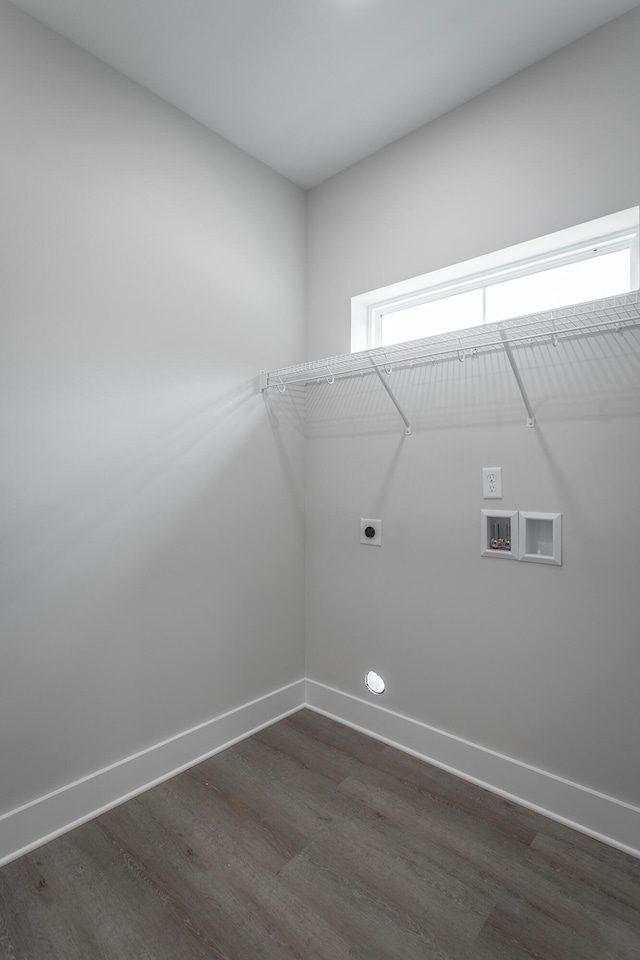 laundry room featuring dark hardwood / wood-style flooring, hookup for a washing machine, and electric dryer hookup