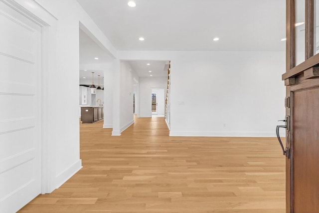 interior space with sink and light wood-type flooring