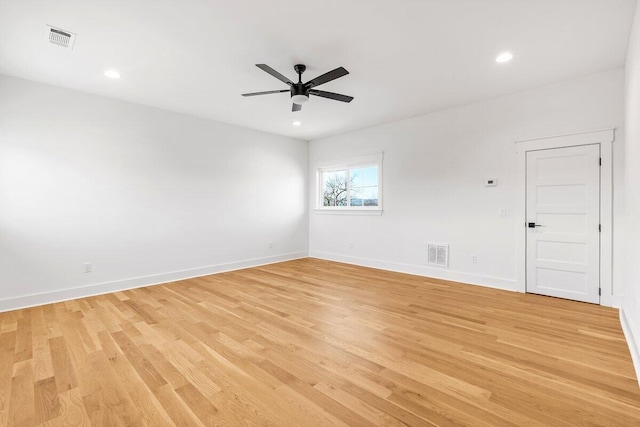 unfurnished room featuring ceiling fan and light hardwood / wood-style floors