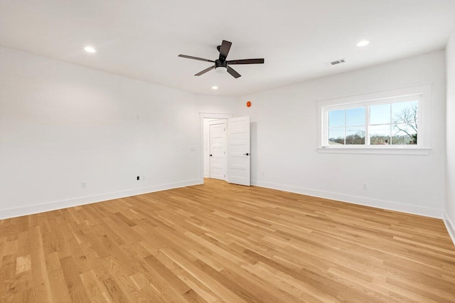 unfurnished room with ceiling fan and light wood-type flooring