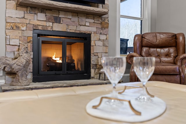 interior space featuring a stone fireplace