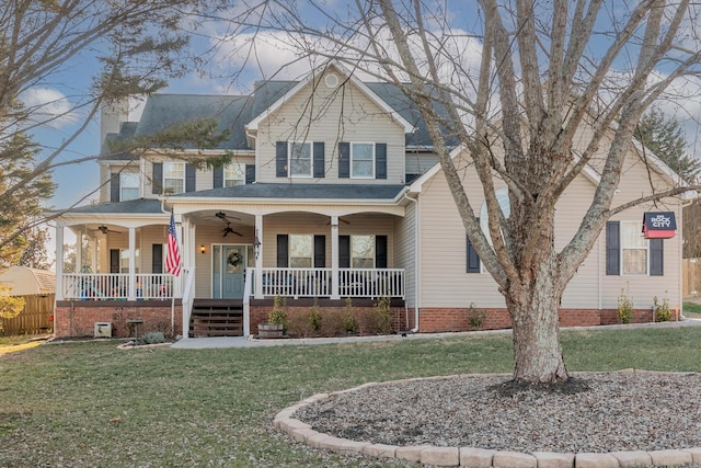 view of front of property featuring a porch, a front yard, and ceiling fan