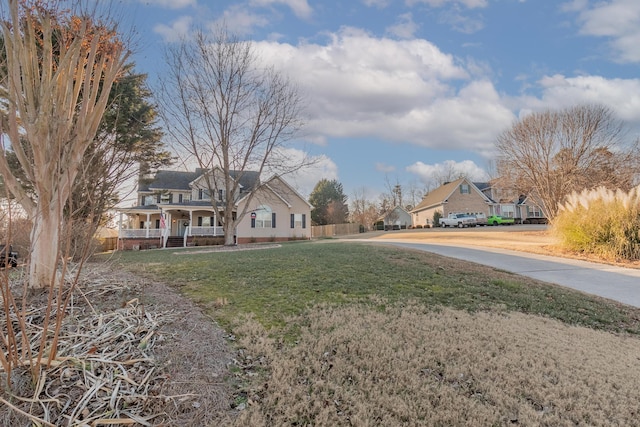 view of yard featuring covered porch