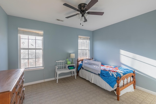 bedroom with light colored carpet and ceiling fan