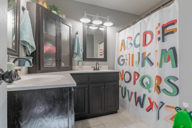 bathroom featuring vanity, tile patterned floors, and walk in shower