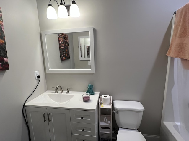 bathroom with vanity and toilet