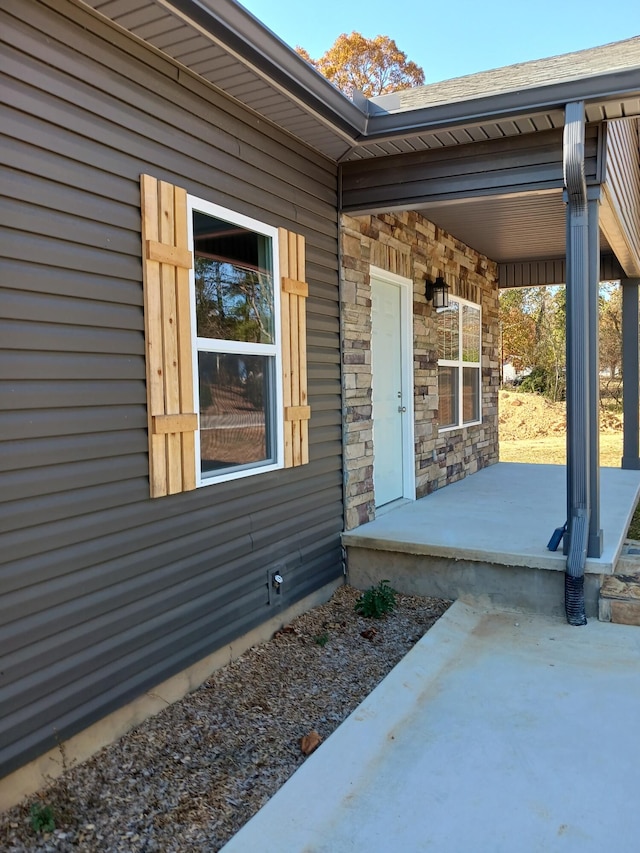 doorway to property with a patio