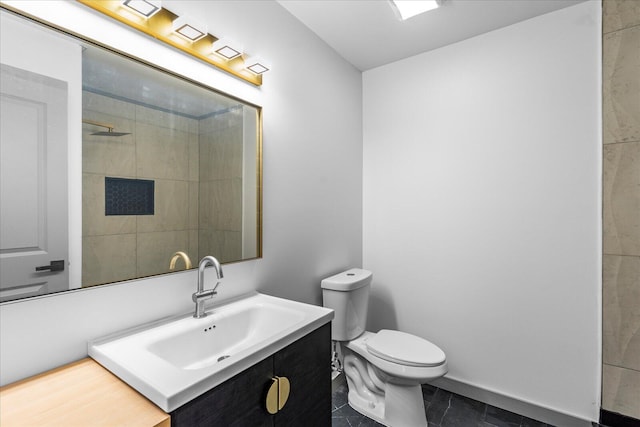bathroom featuring vanity, toilet, and tile patterned floors