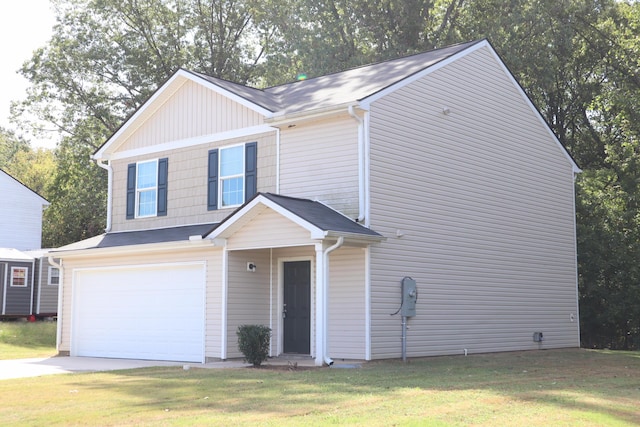 view of front of property with a garage and a front yard