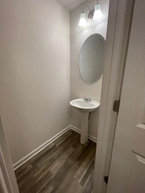 bathroom with hardwood / wood-style flooring