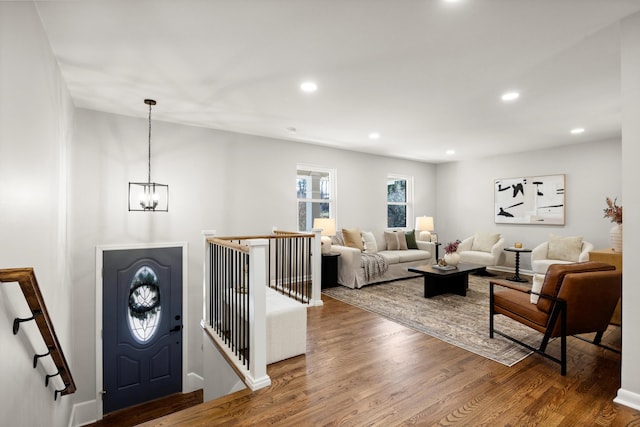 interior space with an inviting chandelier and hardwood / wood-style flooring