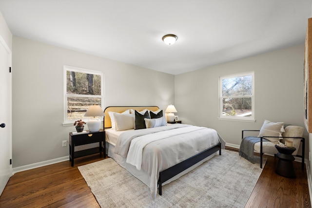 bedroom with hardwood / wood-style flooring