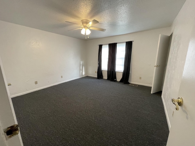 spare room featuring ceiling fan and a textured ceiling