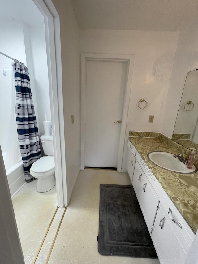 full bathroom with vanity, shower / bathtub combination with curtain, and toilet