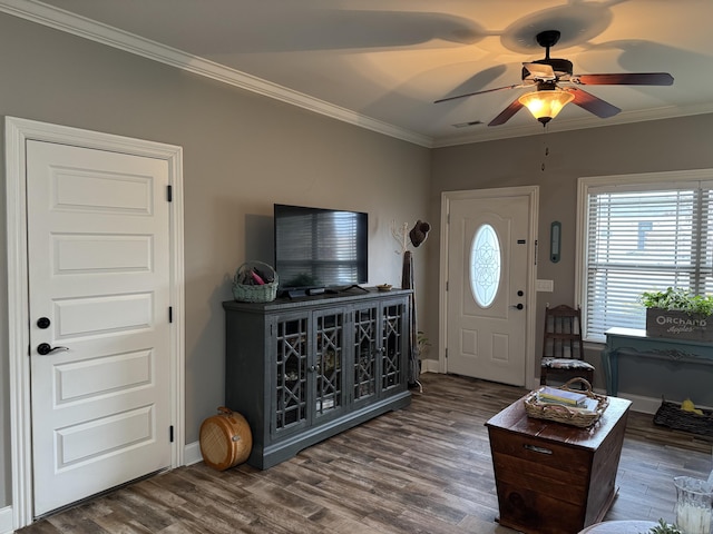 living room featuring crown molding, dark hardwood / wood-style floors, and ceiling fan