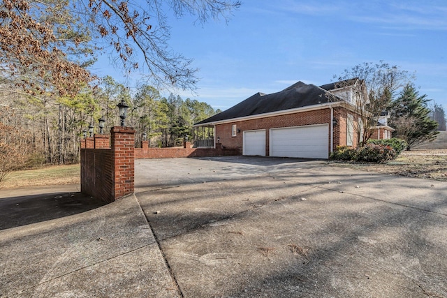 view of property exterior featuring a garage