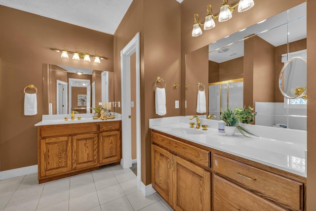 bathroom with vanity, an enclosed shower, and tile patterned floors