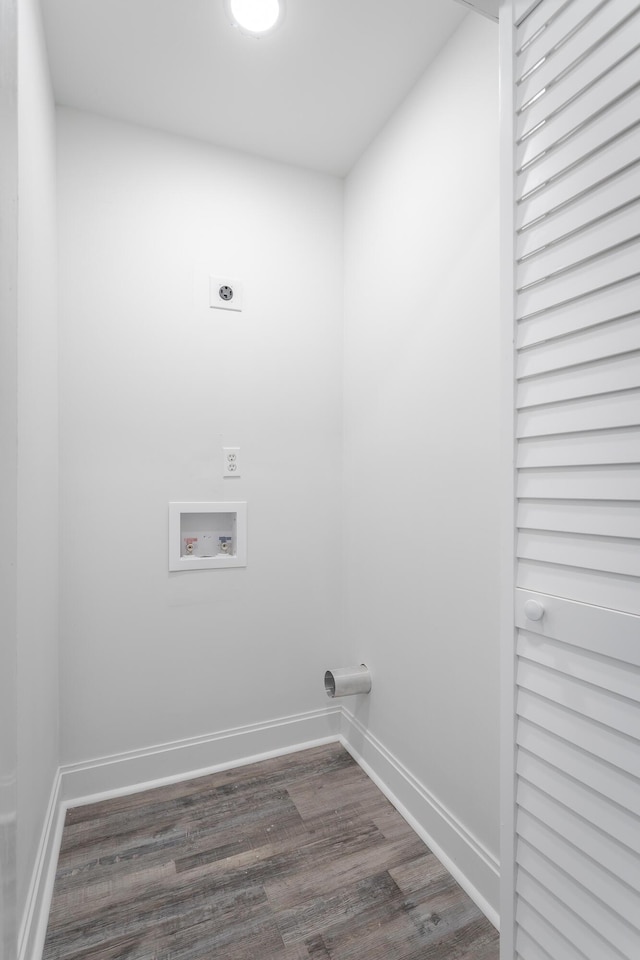 laundry area with dark wood-type flooring, washer hookup, and hookup for an electric dryer