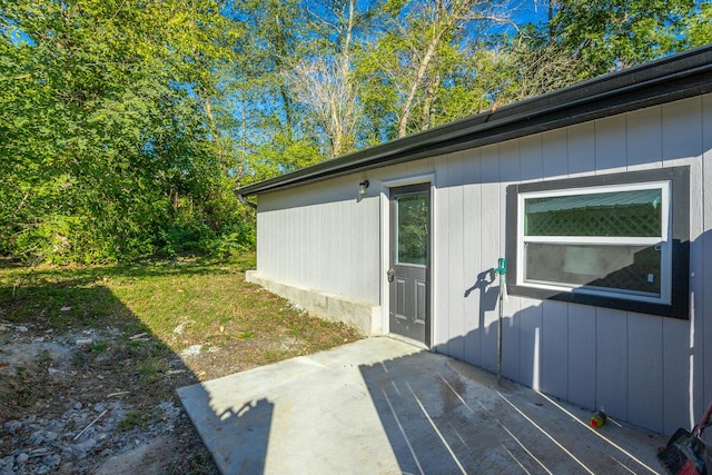 view of side of home featuring a patio