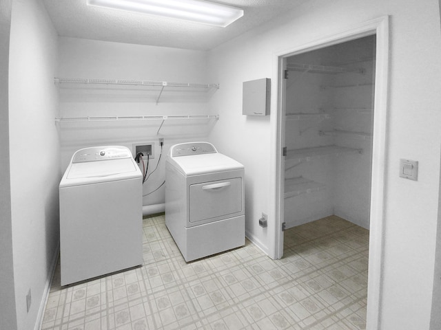 laundry room with separate washer and dryer