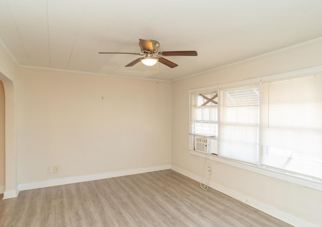 unfurnished room featuring cooling unit, crown molding, light hardwood / wood-style floors, and ceiling fan