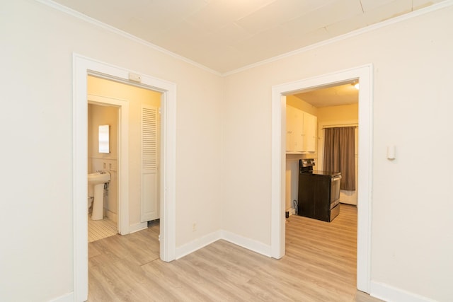 corridor featuring hardwood / wood-style flooring and crown molding