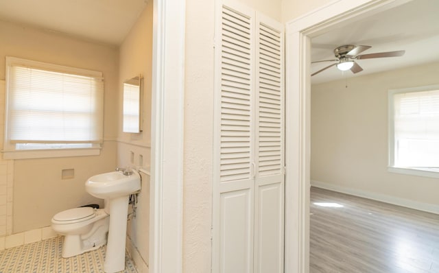 bathroom featuring ceiling fan, wood-type flooring, and toilet