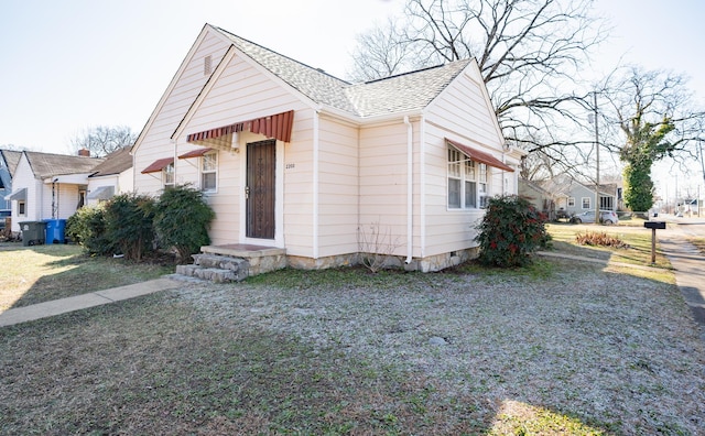 bungalow with a front yard