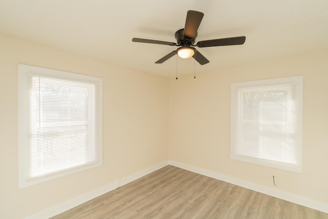 empty room featuring ceiling fan and light wood-type flooring