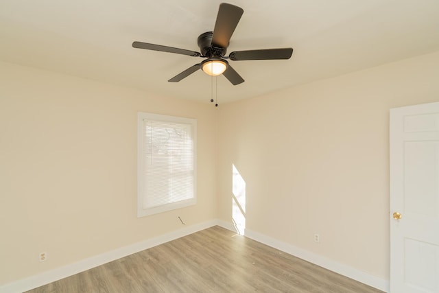 empty room featuring ceiling fan and light hardwood / wood-style flooring