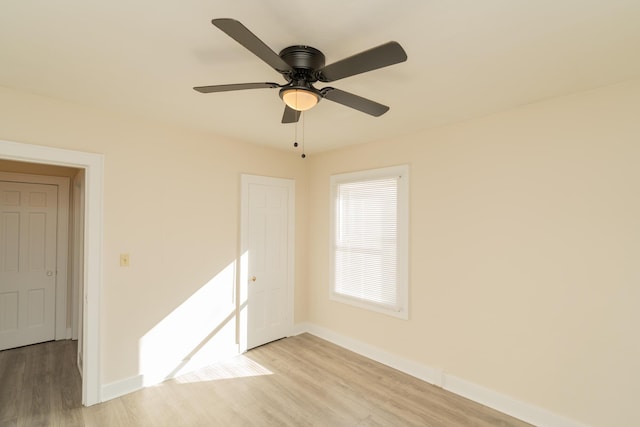 spare room featuring ceiling fan and light hardwood / wood-style floors