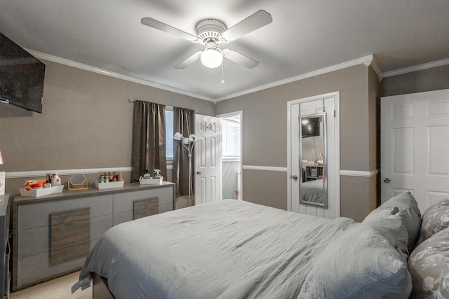 bedroom with crown molding, ceiling fan, and light carpet