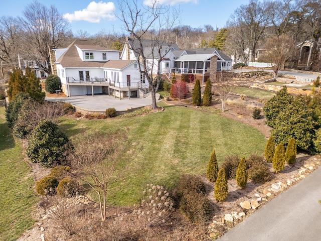 view of yard featuring a wooden deck and a patio area