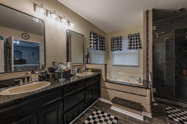 bathroom featuring vanity and plus walk in shower