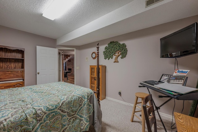 carpeted bedroom featuring a textured ceiling