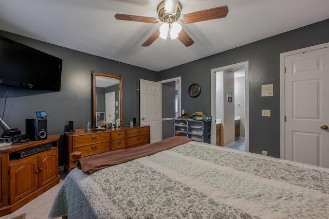 carpeted bedroom with ceiling fan and connected bathroom