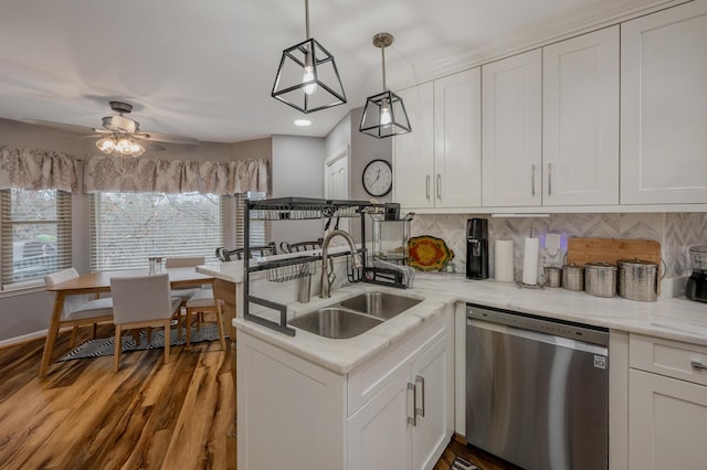 kitchen featuring white cabinetry, sink, tasteful backsplash, and dishwasher