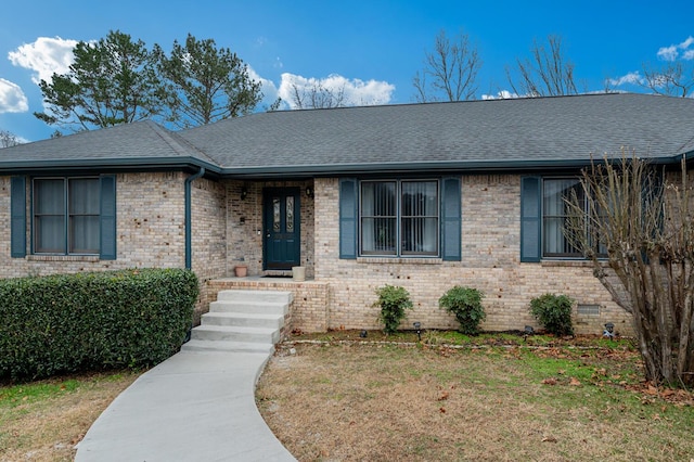 ranch-style house with a front lawn